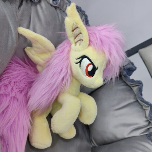 7" long (from bottom to top of the head) sitting Flutterbat plushie