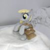 006 7" long sitting Derpy plushie with mane and tail of Minky fabric and a postman's bag