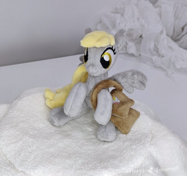 011 7" long sitting Derpy plushie with mane and tail of Minky fabric and a postman's bag