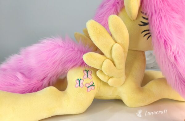 23" long (from hoof to hoof) Fluttershy plushie